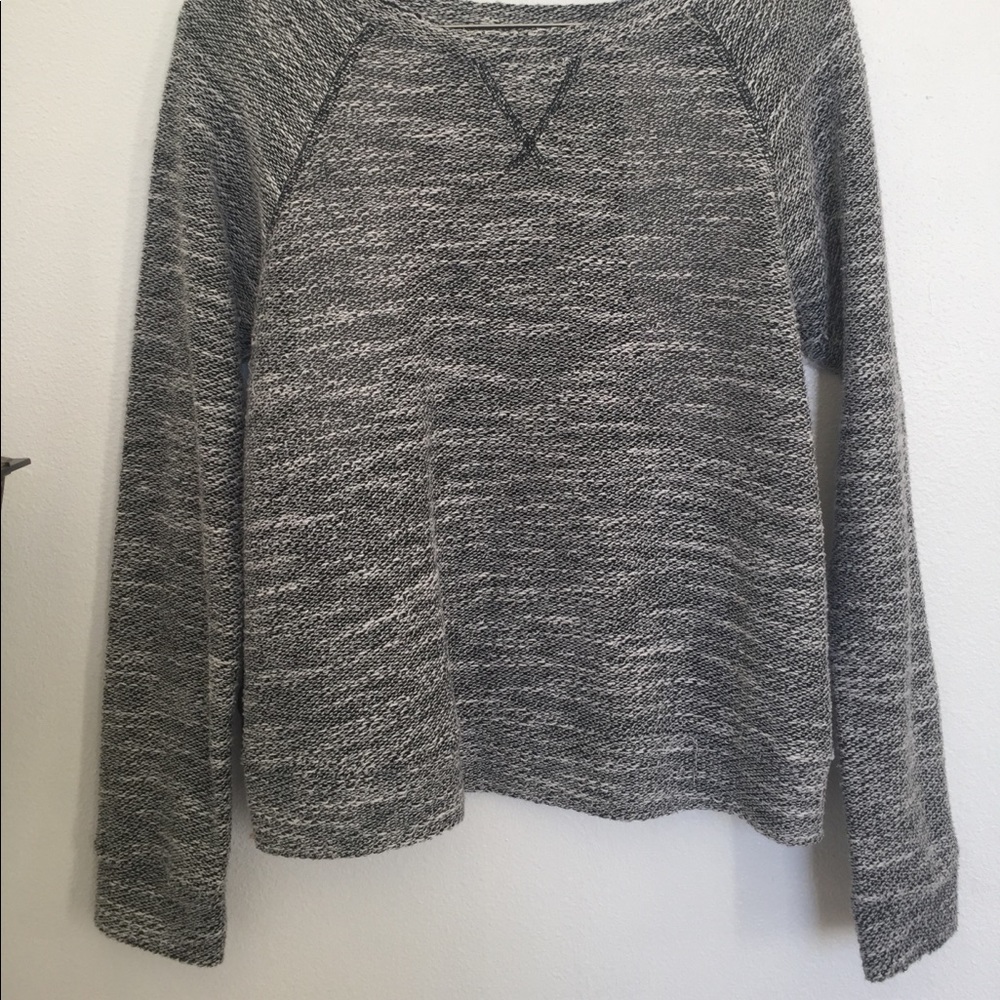 Grey long sleeve shirt.